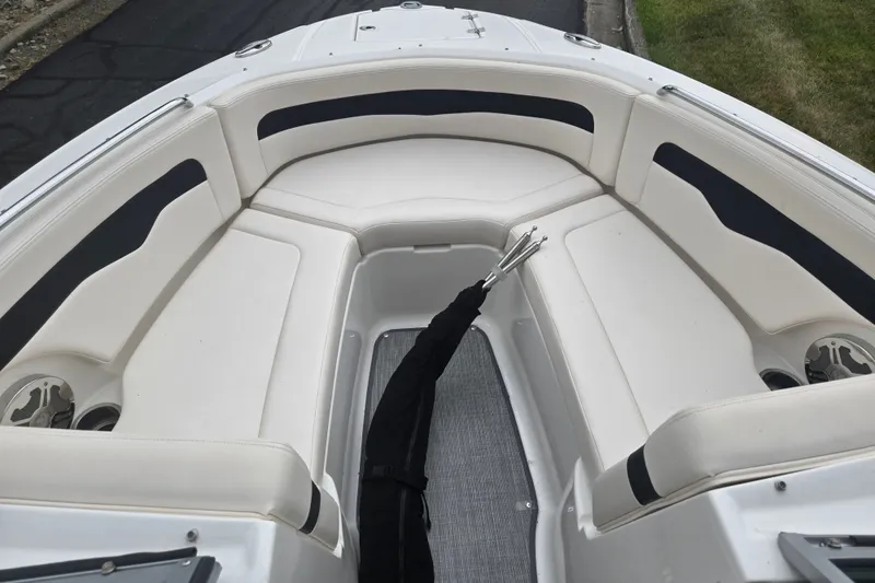 Slide: The Image of 2017 Chaparral 246 SSi boat interior with white seating and black accents. - 18