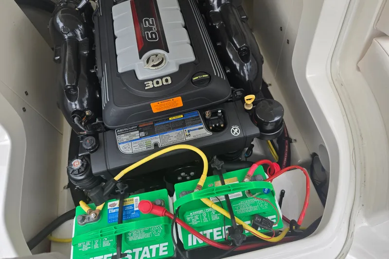 Slide: The Image of Engine compartment of 2017 Chaparral 246 SSi with Mercury 6.2L 300 HP engine and batteries. - 25