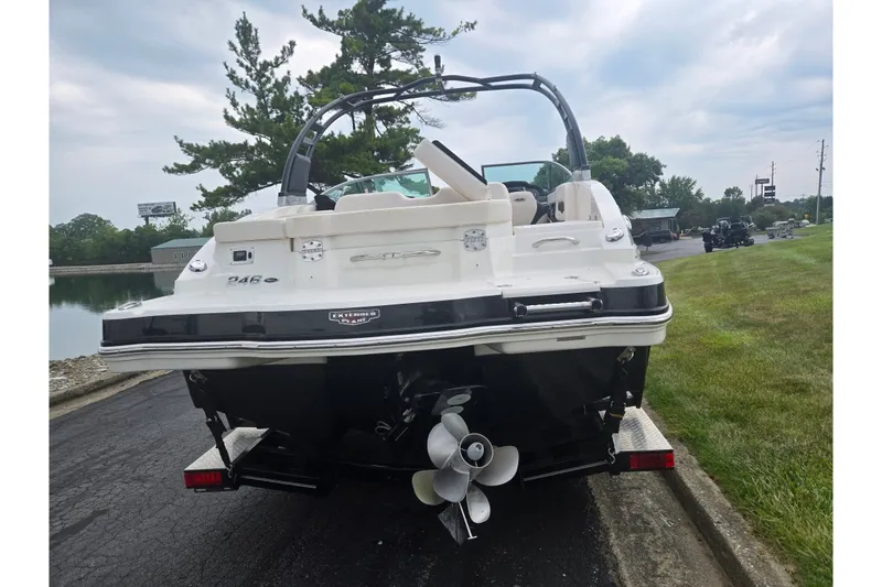 Slide: The Image of 2017 Chaparral 246 SSi boat on trailer, rear view near water. - 2