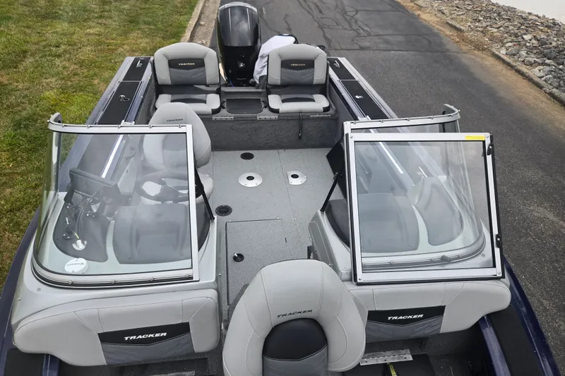 Slide: The Image of 2019 Tracker Targa V-18 Combo boat interior with seating and windshield. - 22