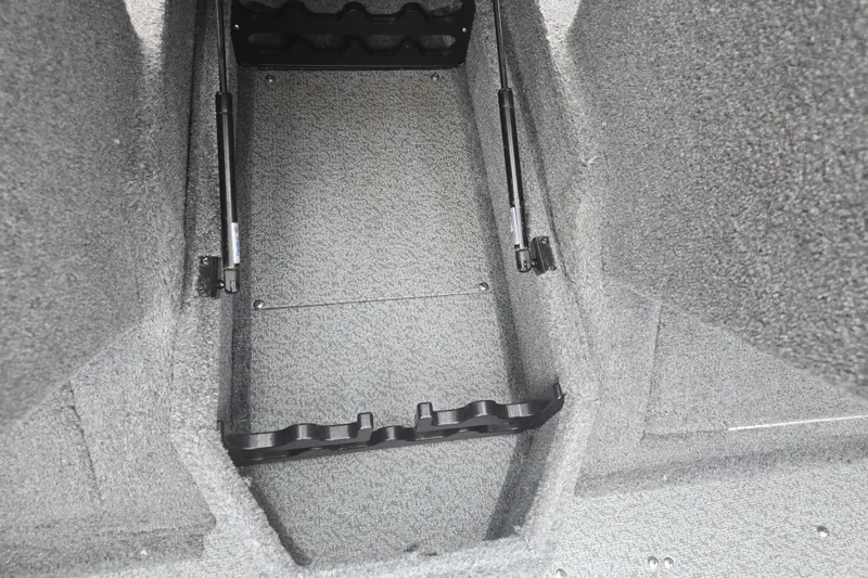Slide: The Image of 2019 Tracker Targa V-18 Combo boat storage compartment with hydraulic lift supports. - 19