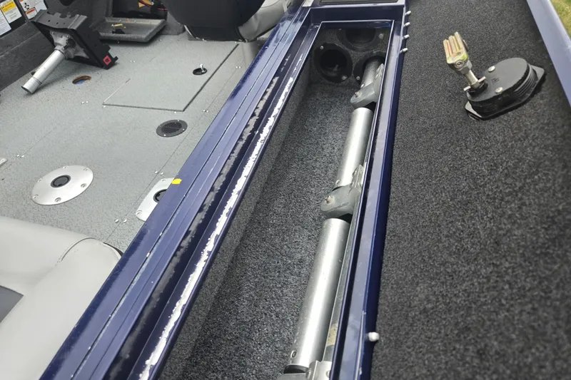 Slide: The Image of Interior view of a 2019 Tracker Targa V-18 Combo boat, showcasing storage compartment. - 15