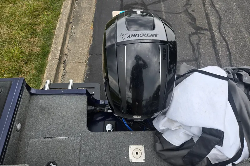 Slide: The Image of 2019 Tracker Targa V-18 Combo boat with Mercury 150 engine, parked on roadside. - 26