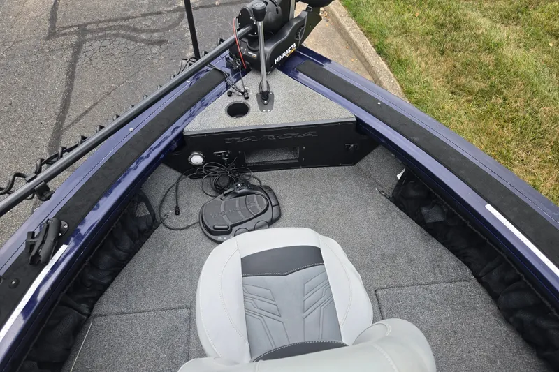 Slide: The Image of 2019 Tracker Targa V-18 Combo boat interior with seating and control panel. - 20