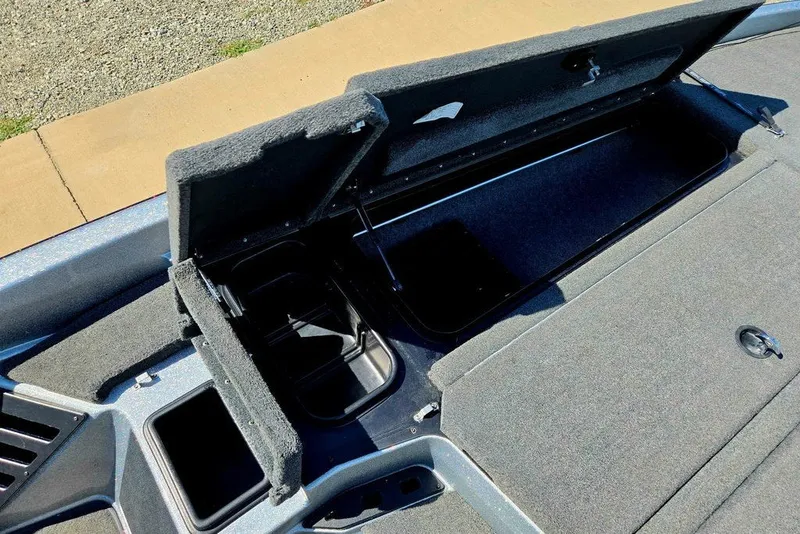 Slide: The Image of Open storage compartments on a 2026 Skeeter ZXR21 boat, showcasing interior space. - 20