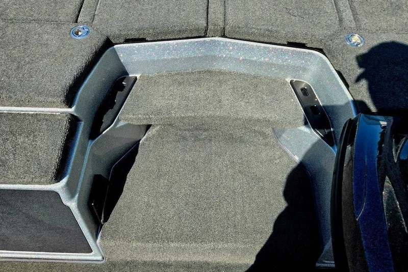 Slide: The Image of Carpeted deck of 2026 Skeeter ZXR21 boat with metallic accents. - 13