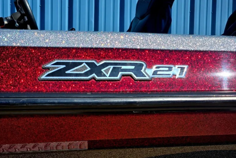 Slide: The Image of 2026 Skeeter ZXR21 boat with glittery red finish and model emblem. - 35