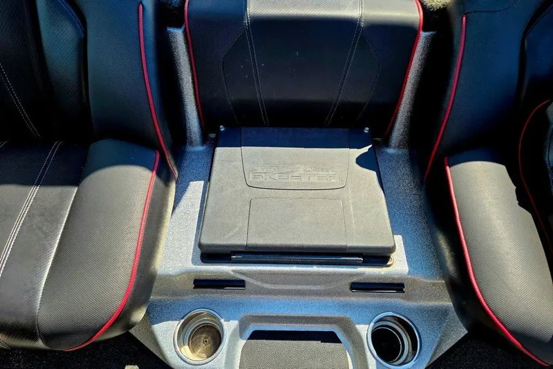 Slide: The Image of 2026 Skeeter ZXR21 boat interior with black seats and red accents. - 17