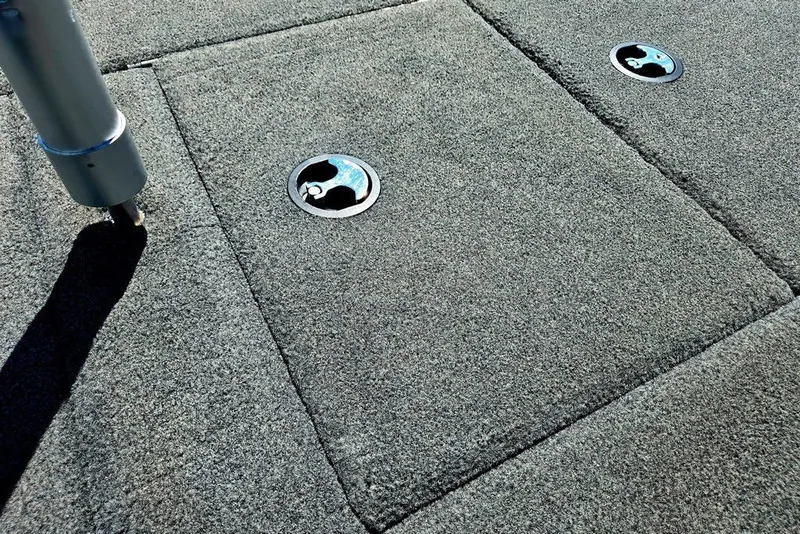 Slide: The Image of Carpeted deck of 2026 Skeeter ZXR21 boat with metal fixtures. - 42