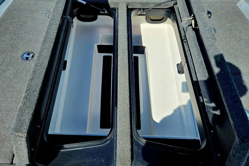 Slide: The Image of Storage compartments of a 2026 Skeeter ZXR21 boat, featuring spacious interior design. - 21