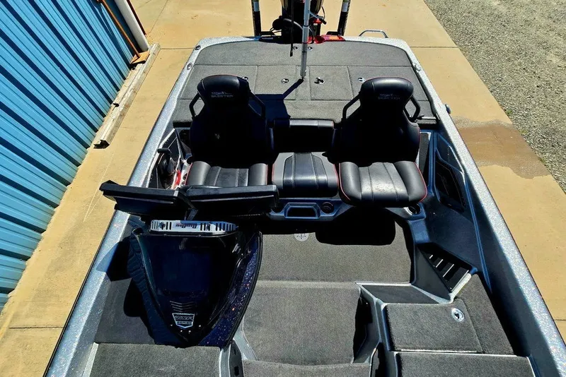 Slide: The Image of 2026 Skeeter ZXR21 boat interior with dual black seats and spacious deck layout. - 22