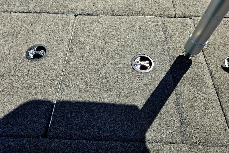 Slide: The Image of Deck of 2026 Skeeter ZXR21 boat with metal fixtures and shadow. - 34