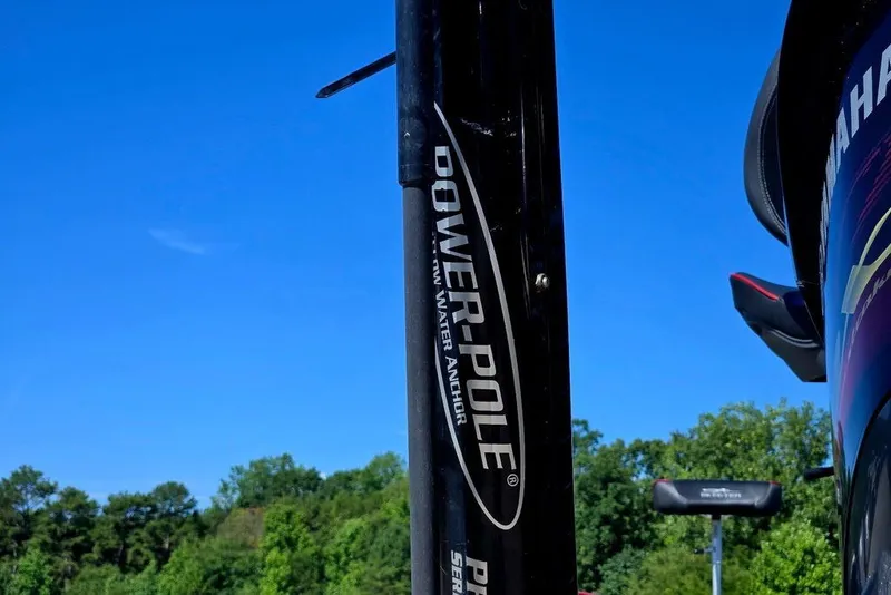 Slide: The Image of Close-up of Power-Pole anchor on 2026 Skeeter ZXR21 boat against clear blue sky. - 47