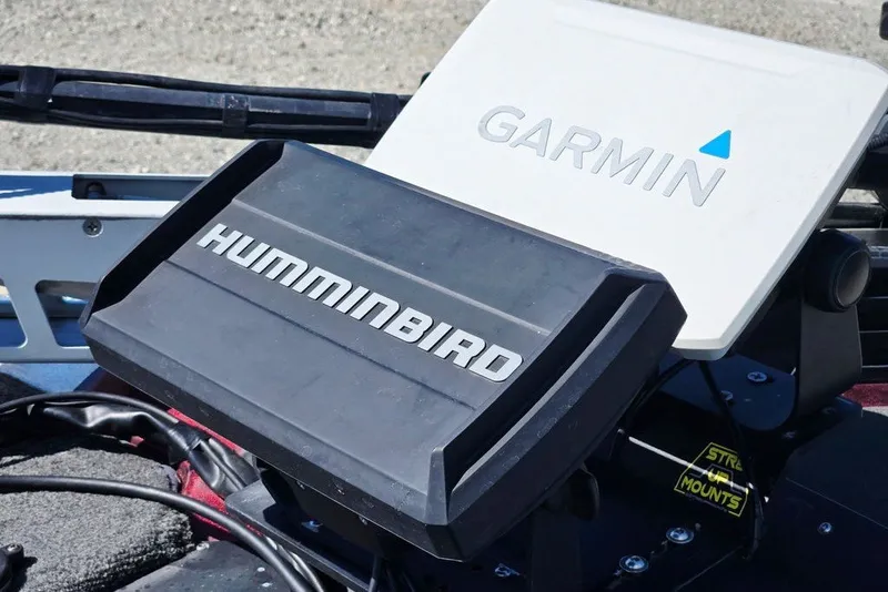 Slide: The Image of Fishfinder and GPS units on a 2026 Skeeter ZXR21 boat dashboard. - 54