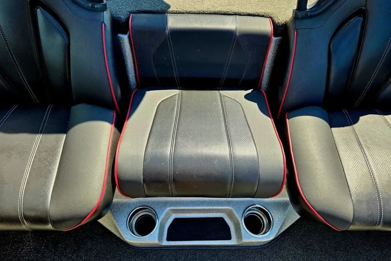 Slide: The Image of 2026 Skeeter ZXR21 boat seating with black upholstery and red accents. - 16