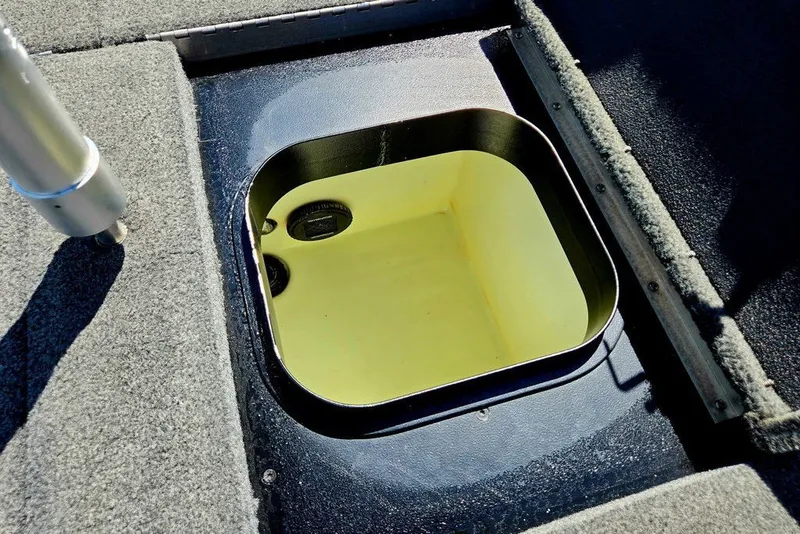 Slide: The Image of Open storage compartment on 2026 Skeeter ZXR21 boat deck. - 30