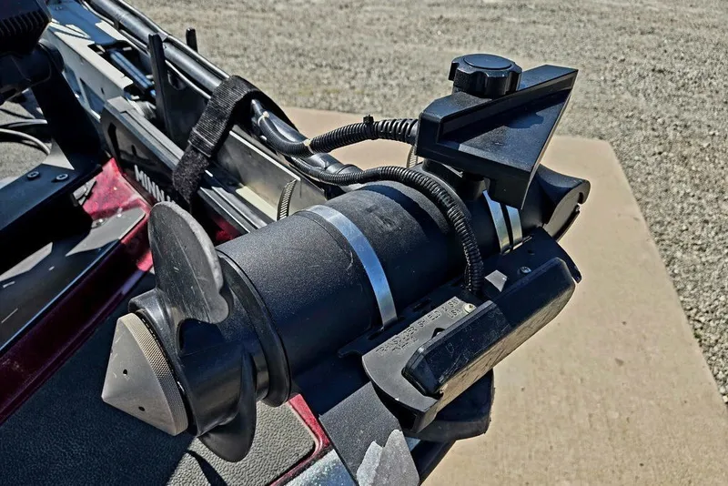 Slide: The Image of Close-up of a 2026 Skeeter ZXR21 boat motor component, featuring detailed wiring and controls. - 55