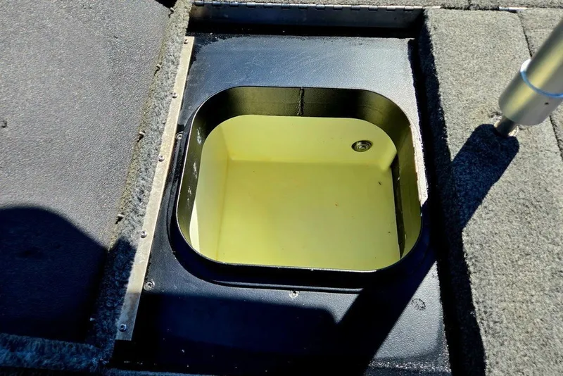 Slide: The Image of Open storage compartment on 2026 Skeeter ZXR21 boat deck. - 31