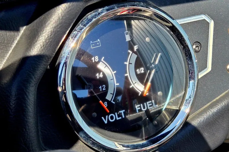 Slide: The Image of Close-up of 2026 Skeeter ZXR21 dashboard gauge showing voltage and fuel levels. - 28