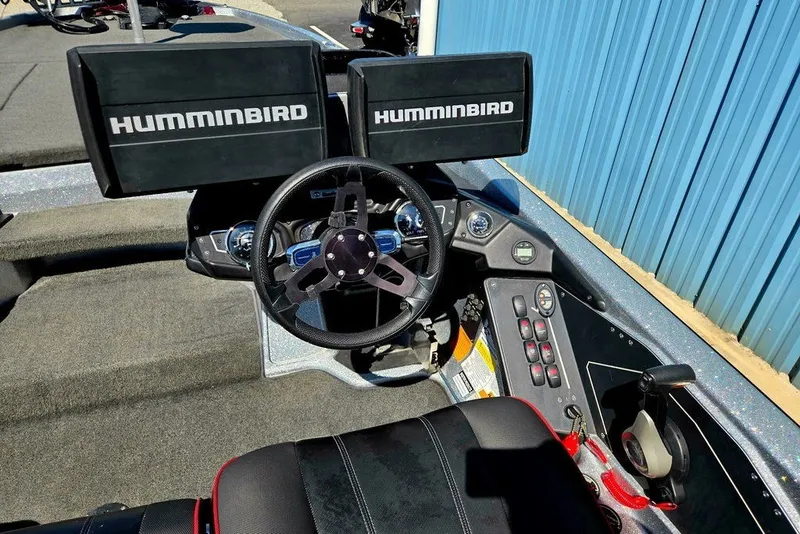 Slide: The Image of Cockpit of 2026 Skeeter ZXR21 boat with dual Humminbird displays and steering wheel. - 10