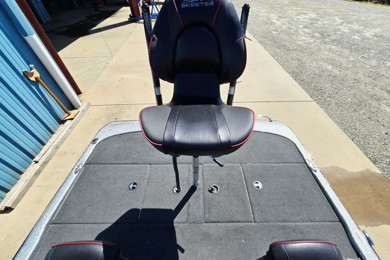 Slide: The Image of 2026 Skeeter ZXR21 boat seat on deck, outdoor setting. - 50
