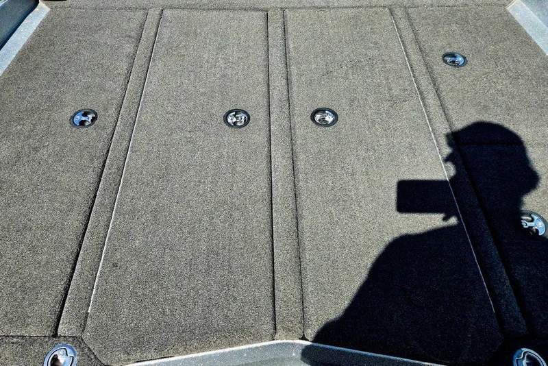 Slide: The Image of 2026 Skeeter ZXR21 boat deck with shadow and metal fixtures. - 8
