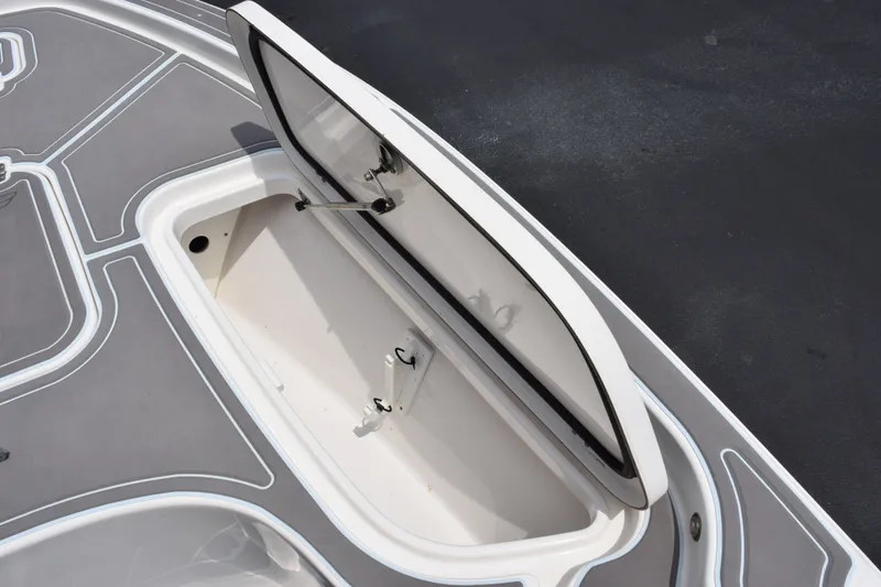 Slide: The Image of Open storage compartment on 2016 Sea Hunt BX22BR boat deck. - 16