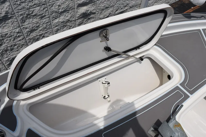 Slide: The Image of Open storage compartment on 2016 Sea Hunt BX22BR boat deck. - 18