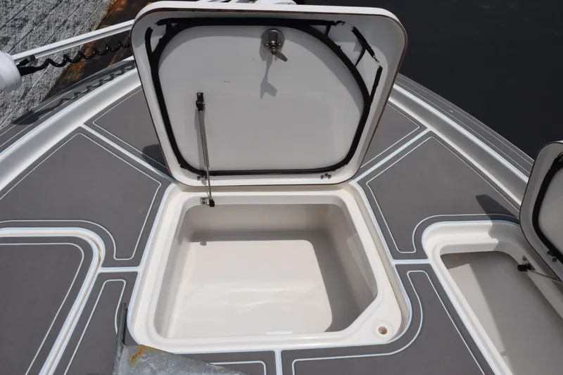 Slide: The Image of Open storage compartment on 2016 Sea Hunt BX22BR boat deck. - 17