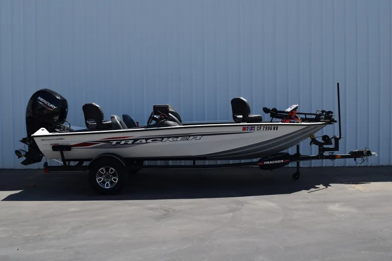 The Image of 2023 Tracker Pro Team 195 TXW Tournament Edition boat on trailer, side view. - 0