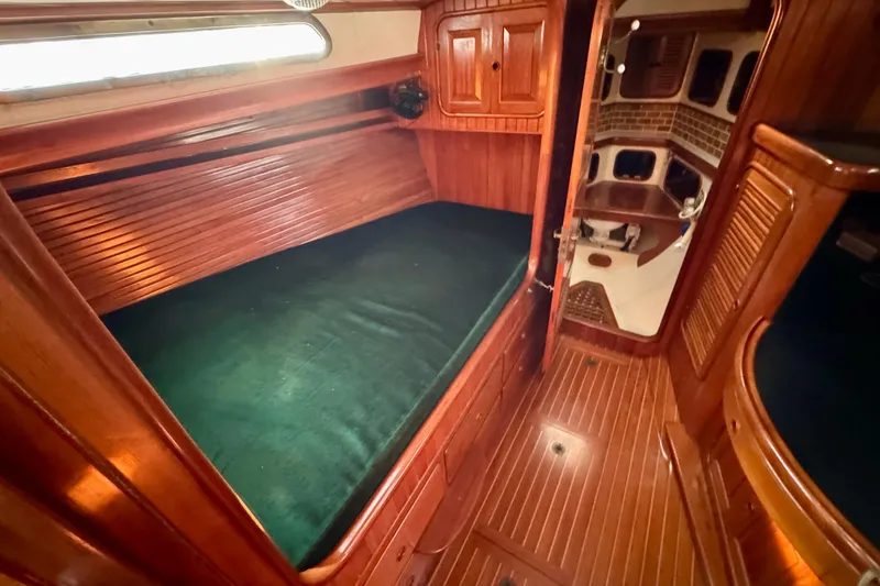 Slide: The Image of Luxurious 1988 Hans Christian Christina yacht interior with wooden finish and cozy sleeping area. - 19