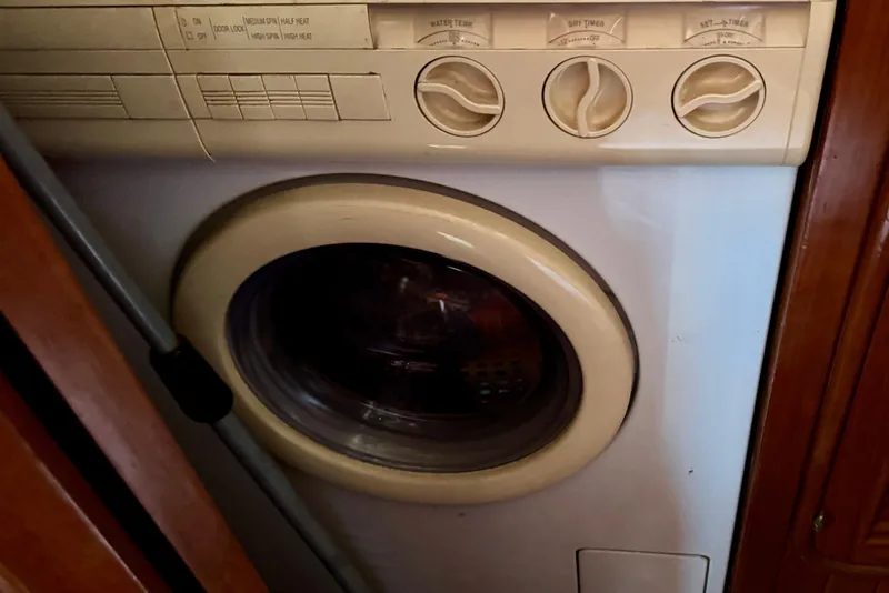 Slide: The Image of 1988 Hans Christian Christina washing machine with beige controls and front-loading door. - 17