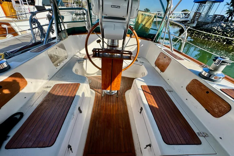 Slide: The Image of Cockpit of 1988 Hans Christian Christina sailboat with wooden accents and steering wheel. - 26