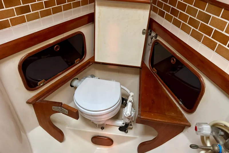 Slide: The Image of 1988 Hans Christian Christina boat bathroom with wooden accents and marine toilet. - 23