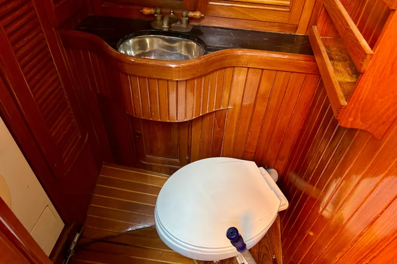 Slide: The Image of Wood-paneled boat bathroom with sink and toilet, Hans Christian Christina 1988 model. - 16