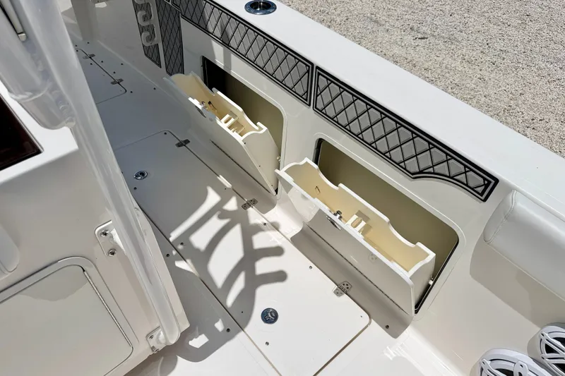 Slide: The Image of 2018 Wellcraft 302 Fisherman boat interior with storage compartments and sleek design. - 44