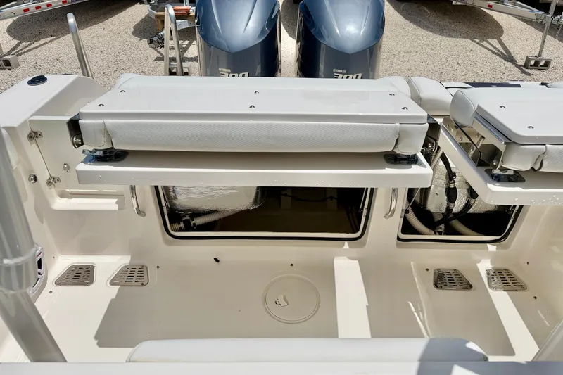 Slide: The Image of 2018 Wellcraft 302 Fisherman boat interior with seating and storage compartments. - 37