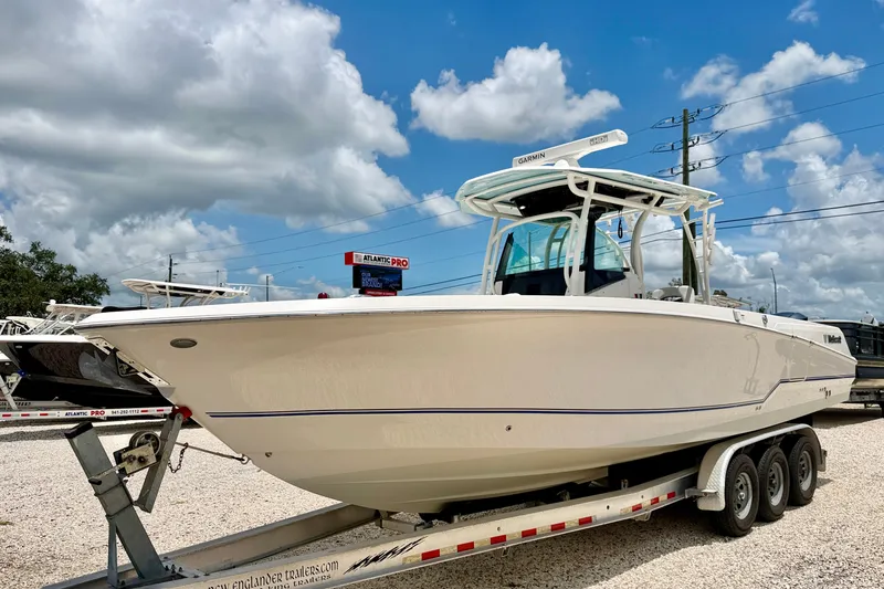 Slide: The Image of 2018 Wellcraft 302 Fisherman boat on trailer under blue sky. - 1