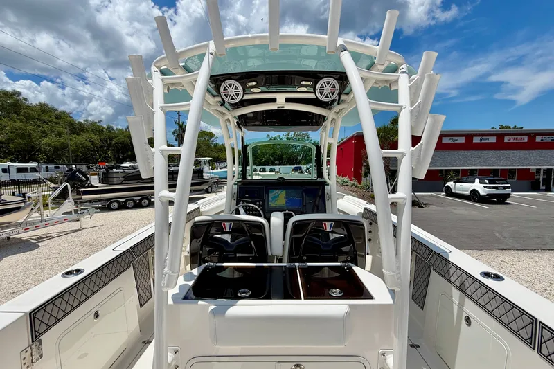 Slide: The Image of 2018 Wellcraft 302 Fisherman boat interior with dual seats and navigation system. - 26