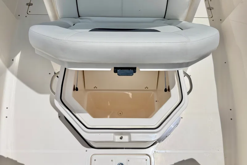 Slide: The Image of 2018 Wellcraft 302 Fisherman boat seat with open storage compartment. - 14