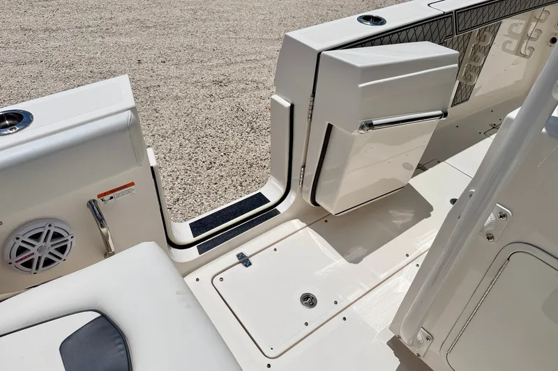 Slide: The Image of 2018 Wellcraft 302 Fisherman boat interior with open door and speaker. - 48