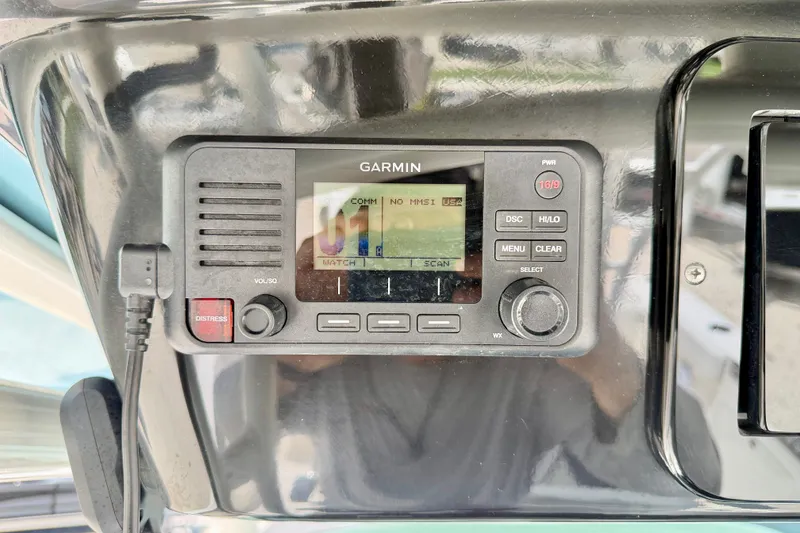 Slide: The Image of Garmin marine radio on 2018 Wellcraft 302 Fisherman boat dashboard. - 28