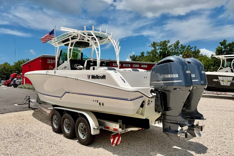 Slide: The Image of 2018 Wellcraft 302 Fisherman boat on trailer with dual Yamaha engines. - 5
