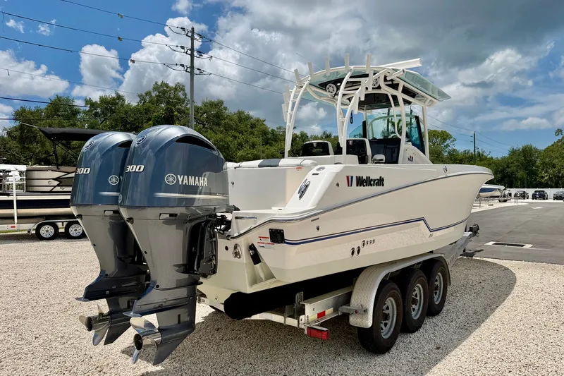 Slide: The Image of 2018 Wellcraft 302 Fisherman boat with dual Yamaha 300 engines on a trailer. - 7