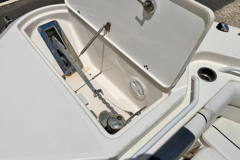 Slide: The Image of Open anchor compartment on 2018 Wellcraft 302 Fisherman boat, showing anchor and chain. - 40