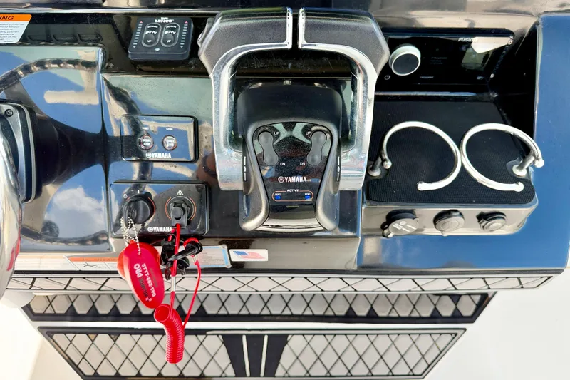 Slide: The Image of Control panel of a 2018 Wellcraft 302 Fisherman boat with Yamaha controls. - 23