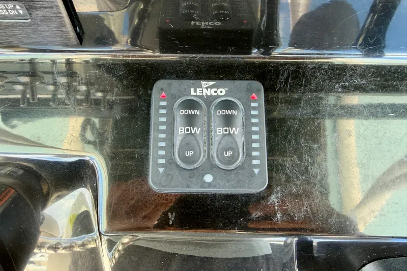 Slide: The Image of Lenco trim tab control on 2018 Wellcraft 302 Fisherman boat dashboard. - 24