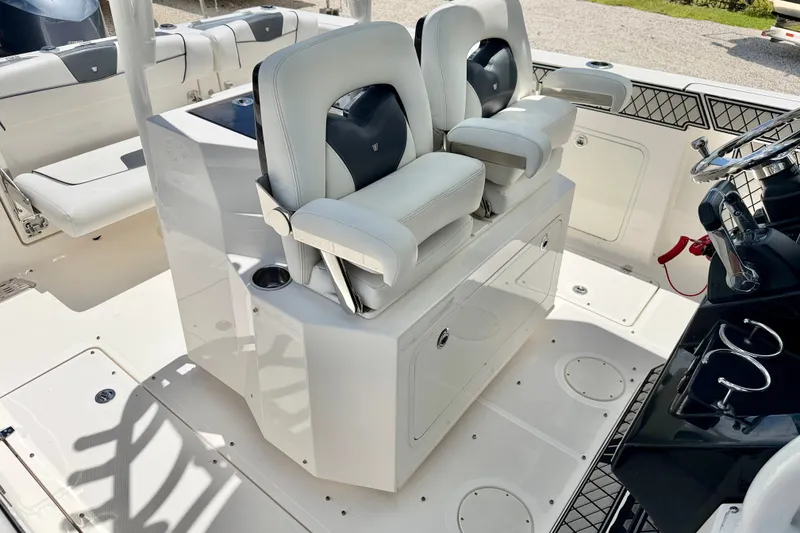 Slide: The Image of 2018 Wellcraft 302 Fisherman boat interior with dual helm seats and modern console. - 17