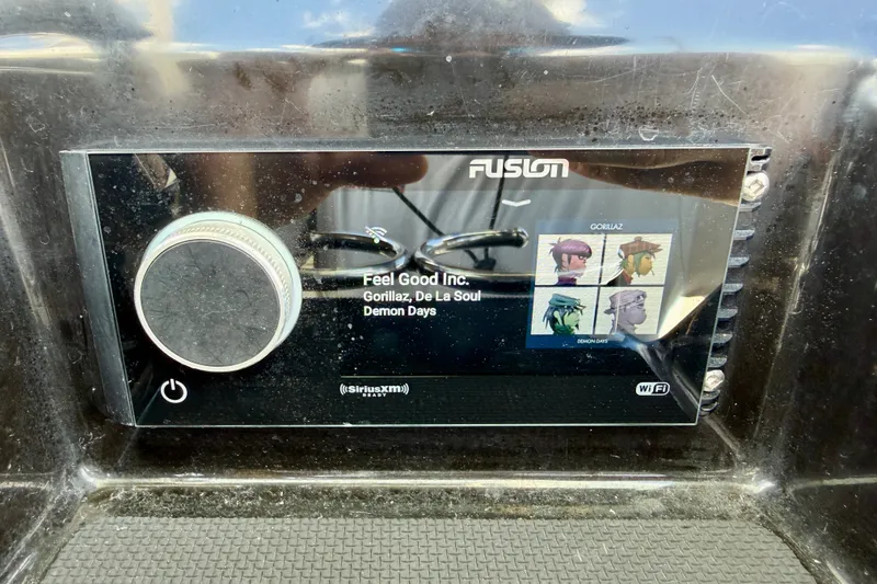Slide: The Image of Fusion stereo system on 2018 Wellcraft 302 Fisherman displaying "Feel Good Inc." by Gorillaz. - 25