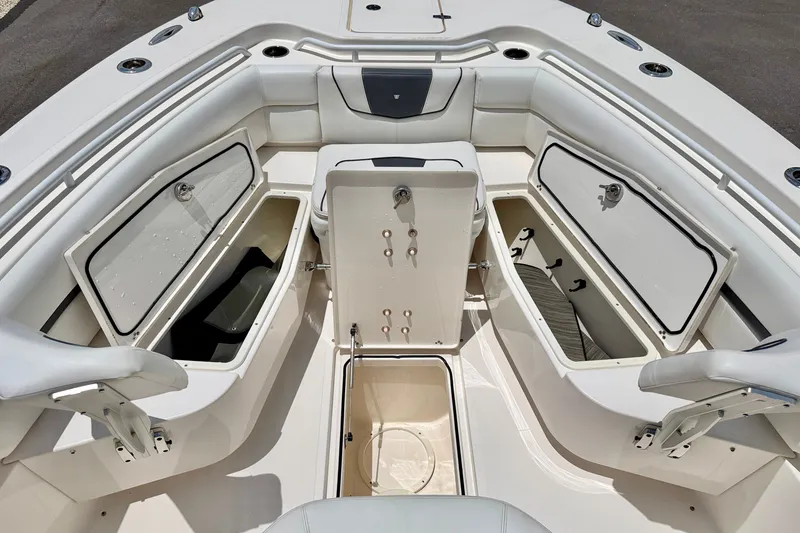 Slide: The Image of 2018 Wellcraft 302 Fisherman boat interior with open storage compartments and seating. - 41